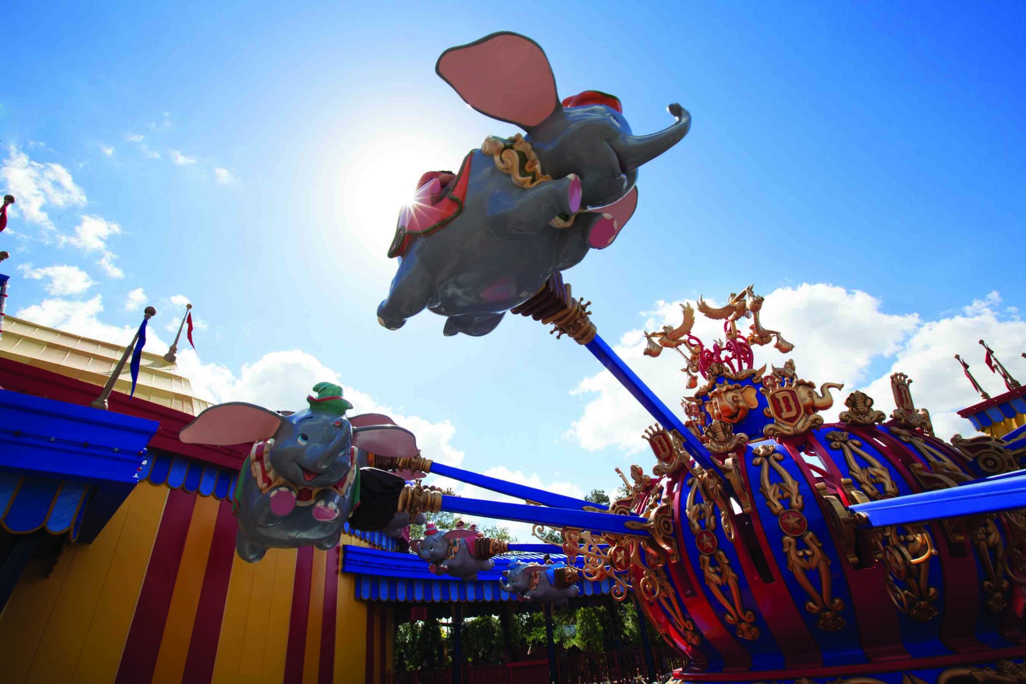 Guests take a spin on “Dumbo, the Flying Elephant” at Magic Kingdom Park. With an unprecedented two Dumbos aloft, guests get to their flights faster aboard one of the park’s most iconic attractions. Connecting the two Dumbos, a new “big top” area allows guests to immerse themselves in circus lore in a series of fun, interactive experiences before a spin with their favorite circus elephant. The double Dumbos help anchor the Storybook Circus area of New Fantasyland at Magic Kingdom Park — part of the largest expansion in Magic Kingdom history. (Disney)